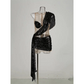 Black sequined elegant one-shoulder mini dress with sheer mesh bodice and draped fabric detail in vibrant emerald green