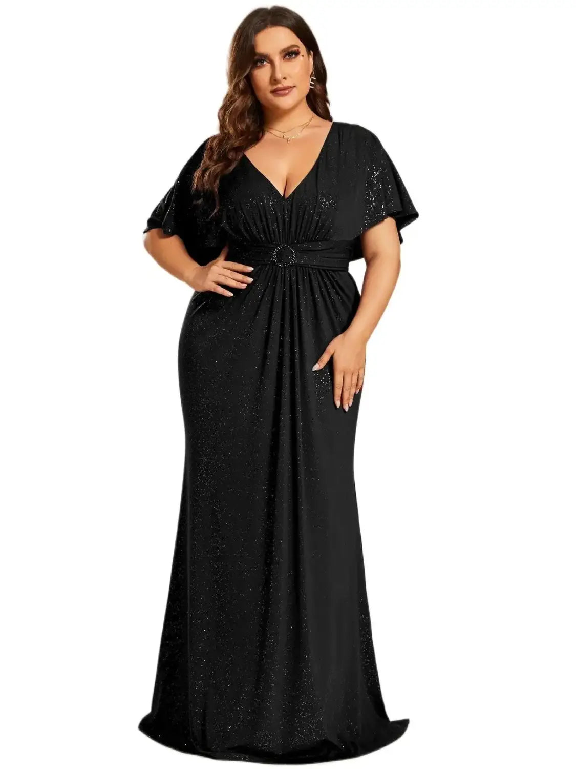 Black sequined plus size evening gown for curvy women with a v-neckline, cape-like short sleeves, and a cinched waist accented by a circular belt, featured in top plus size dresses for 2026.