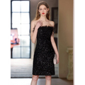 Black sequined feather trim banquet evening dress featuring a strapless design with feather detailing at the shoulders