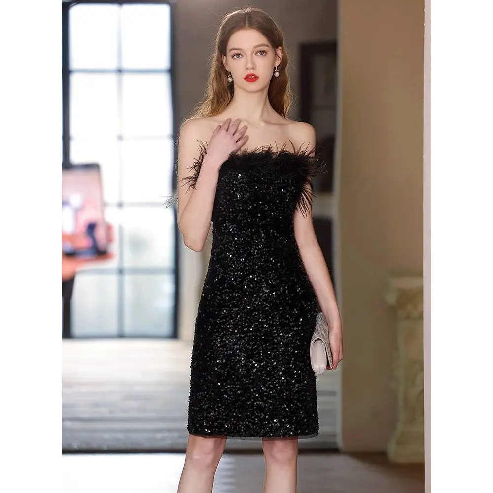 Black sequined feather trim banquet evening dress featuring a strapless design with feather detailing at the shoulders