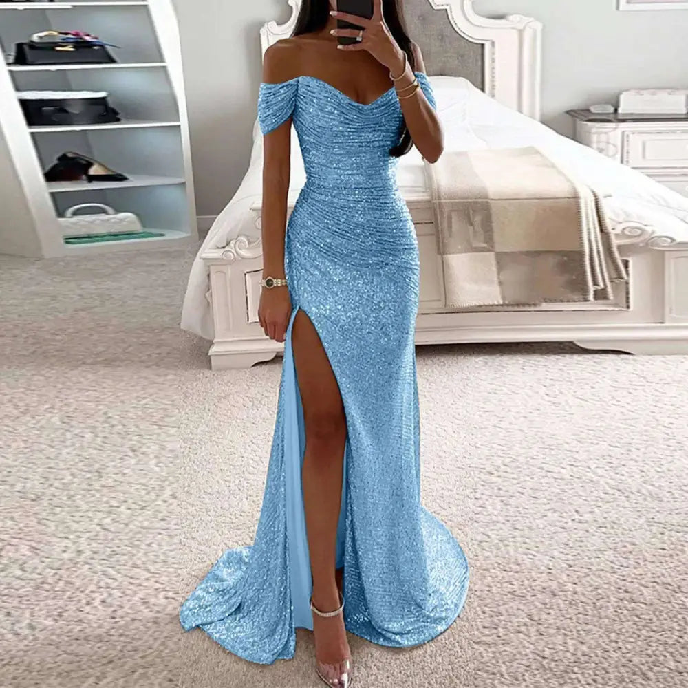 Shimmering light blue sequined off-the-shoulder gown with high slit and flowing train in fitted silhouette