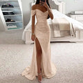 A shimmering rose gold sequined off-the-shoulder gown with high slit and flowing train in a fitted silhouette