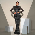 Black sequined long sleeve round neck evening dress with sheer sleeves and silver chain details for banquet evening events