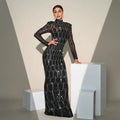 Black sequined long sleeve round neck evening dress with sheer sleeves and silver chain detailing for banquet evening wear