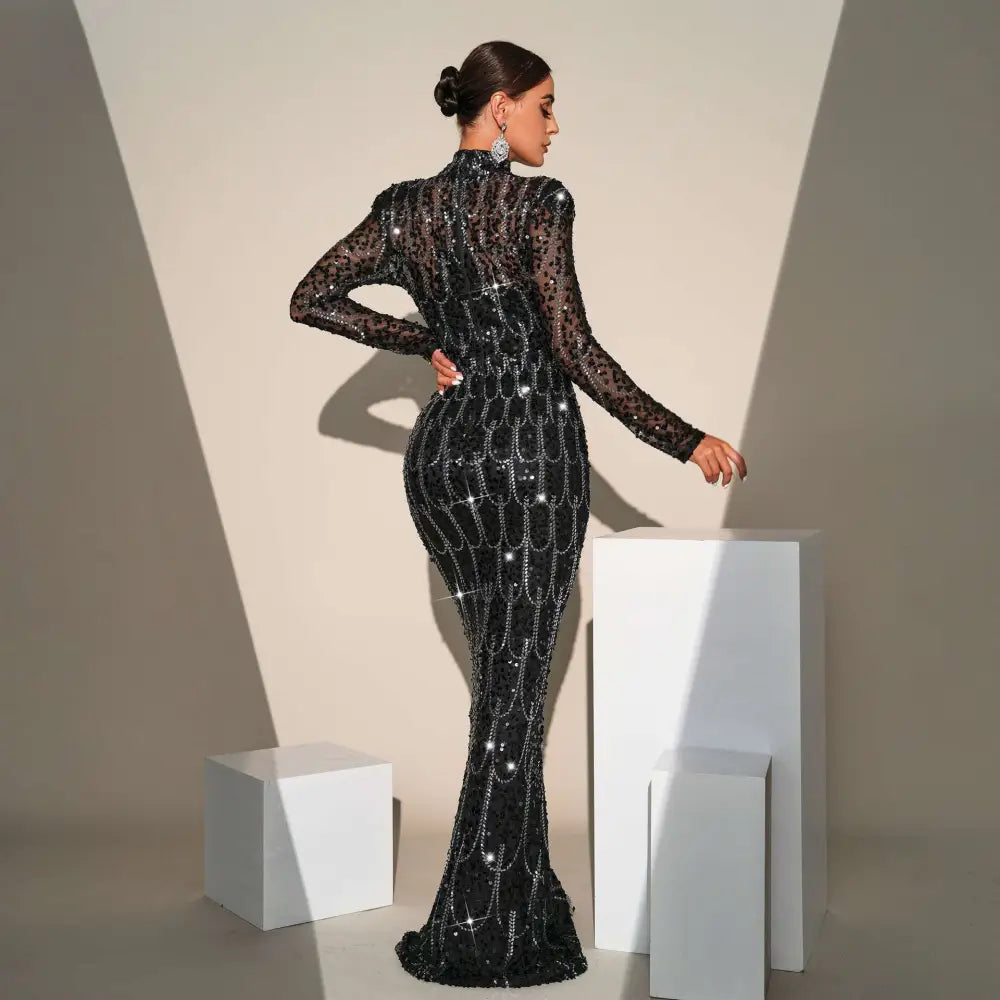 Black sequined long sleeve round neck evening dress with intricate sparkling embellishments for banquet evening wear