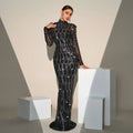 Black sequined long sleeve round neck evening dress with sheer sleeves and silver chain detailing for banquet evening wear