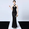 Black sequined mermaid dress with halter neckline and crisscross back detail in shimmering black fabric