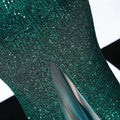 Emerald green sequined mermaid dress with sheer mesh lining and halter neckline featuring a long skirt length
