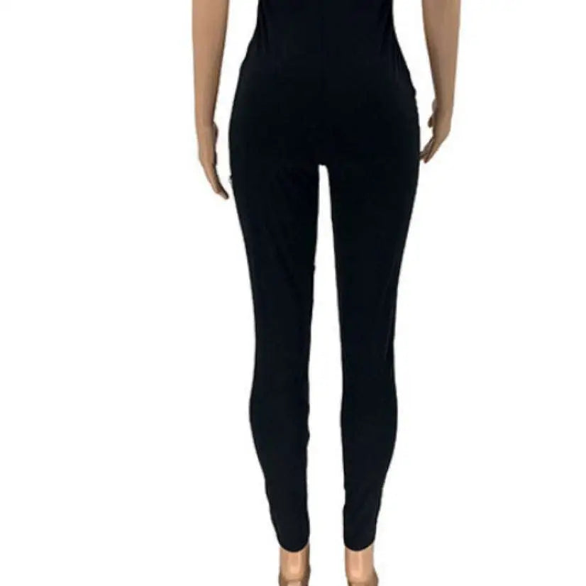 Black stretchy form-fitting leggings featuring ripped detailing and a sheer gold chain for casual sexy ripped style