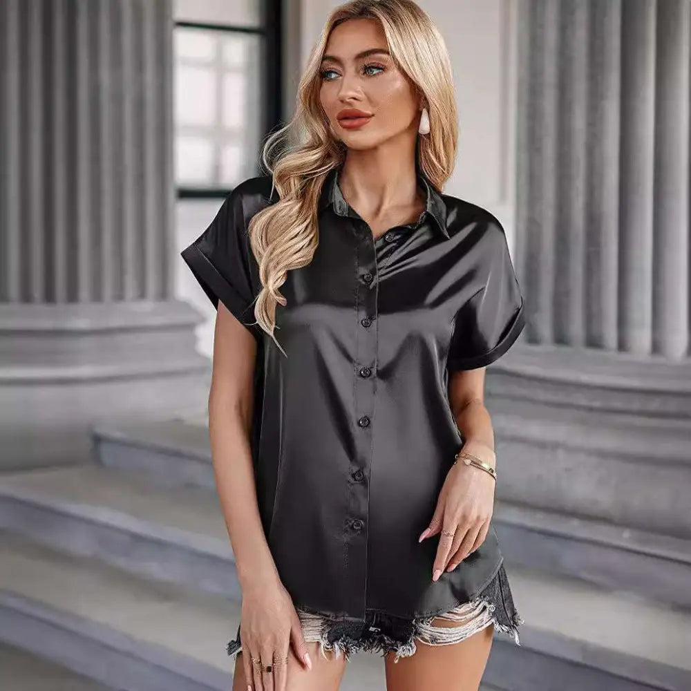 Black short sleeve satin button shirt featuring a collar and slightly flared hem for elegant style