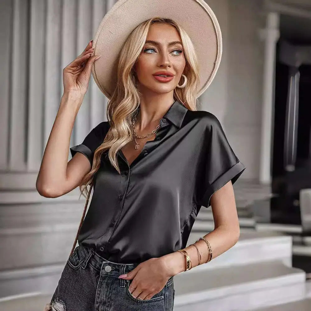 Black short sleeve satin button shirt featuring a sleek black satin button shirt design with short sleeves