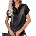 Black short sleeve satin button shirt featuring a collar and smooth satin fabric for a polished look