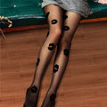 Black sheer snagging resistant sock leggings featuring bold black lipstick kiss marks on sheer fabric