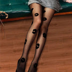 Black sheer snagging resistant sock leggings featuring bold black lipstick kiss marks on sheer fabric