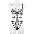 Transparent black lace bodysuit with intricate floral strap detailing in a fashion solid color lace bodysuit set