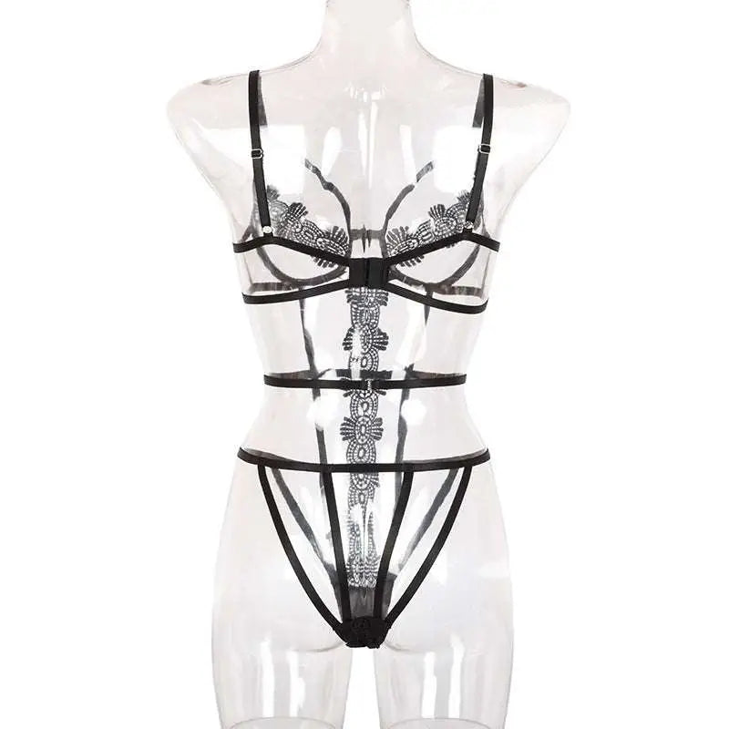 Transparent black lace bodysuit with intricate floral strap detailing in a fashion solid color lace bodysuit set