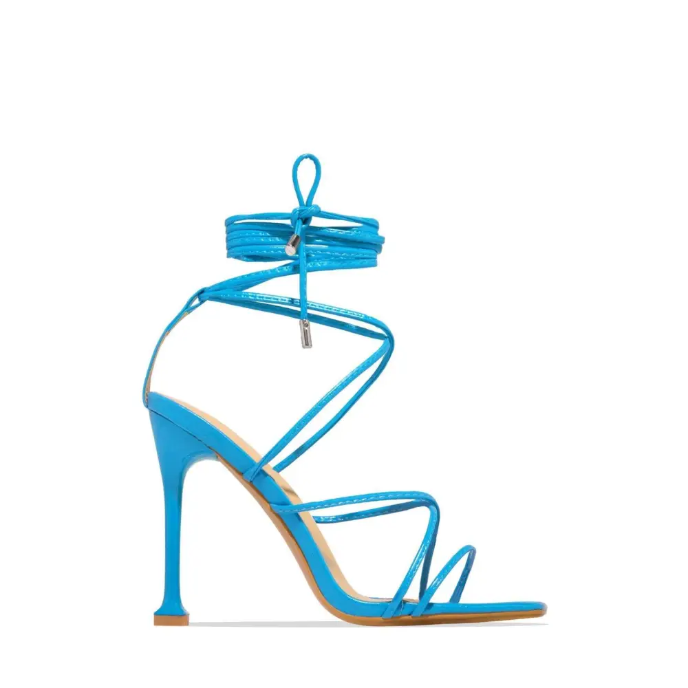 Black square toe high-heeled sandals featuring vibrant turquoise slender stiletto heel and lace-up ankle straps