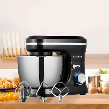 Black stand mixer with stainless steel bowl and three attachments including cream blender and egg beater