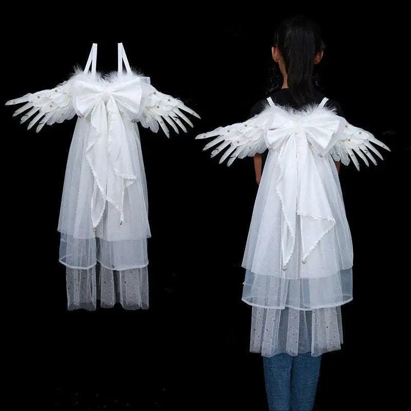White angel wings with sheer tulle and feathered tips featuring a large bow on the back for halloween performance costume props