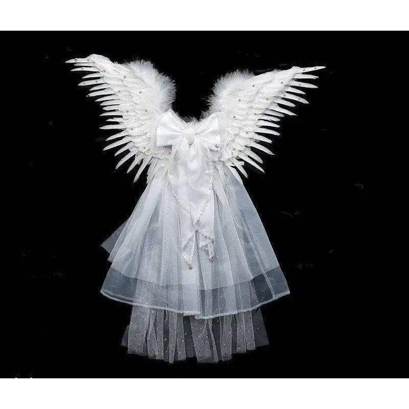 White angel wings with feathered edges and a sheer tulle skirt with sparkling embellishments for black star feathered halloween performance costume