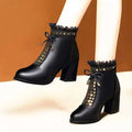 Black studded chunky leather ankle boots with chunky heel martin design featuring gold heart studs and decorative bow