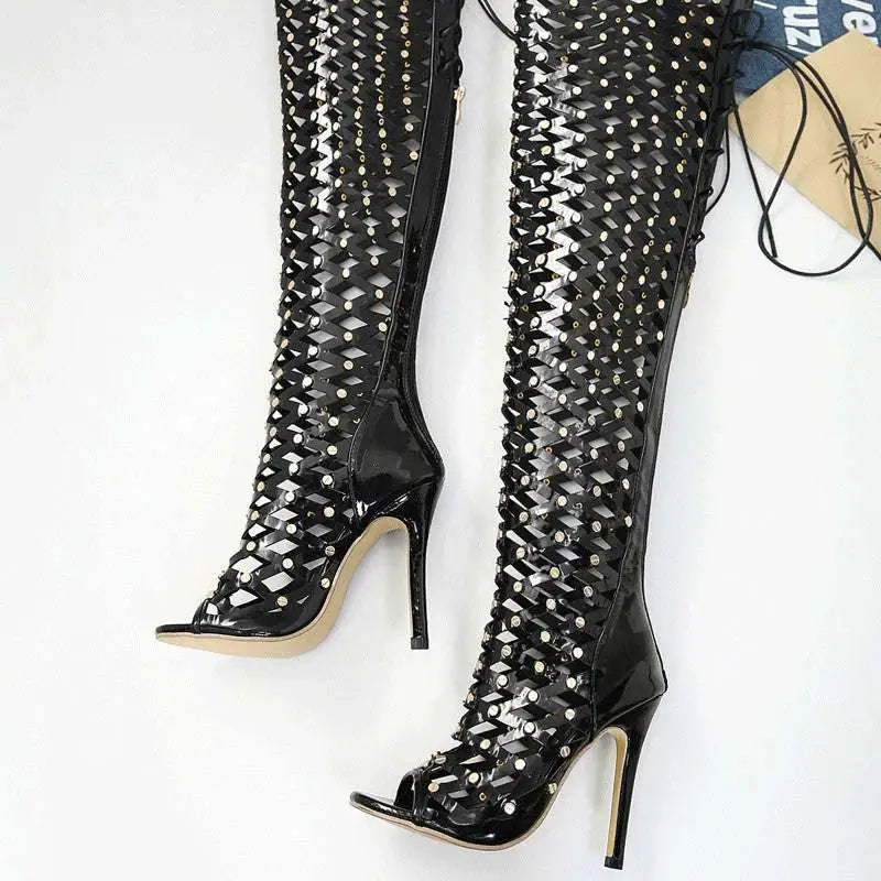 Black studded lace over-the-knee heel sandal boots with glossy finish and intricate rhinestone lattice design