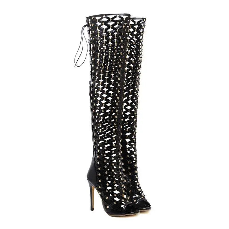 Black studded lace up heel sandal boots featuring a glossy lattice design and silver studs over-the-knee style