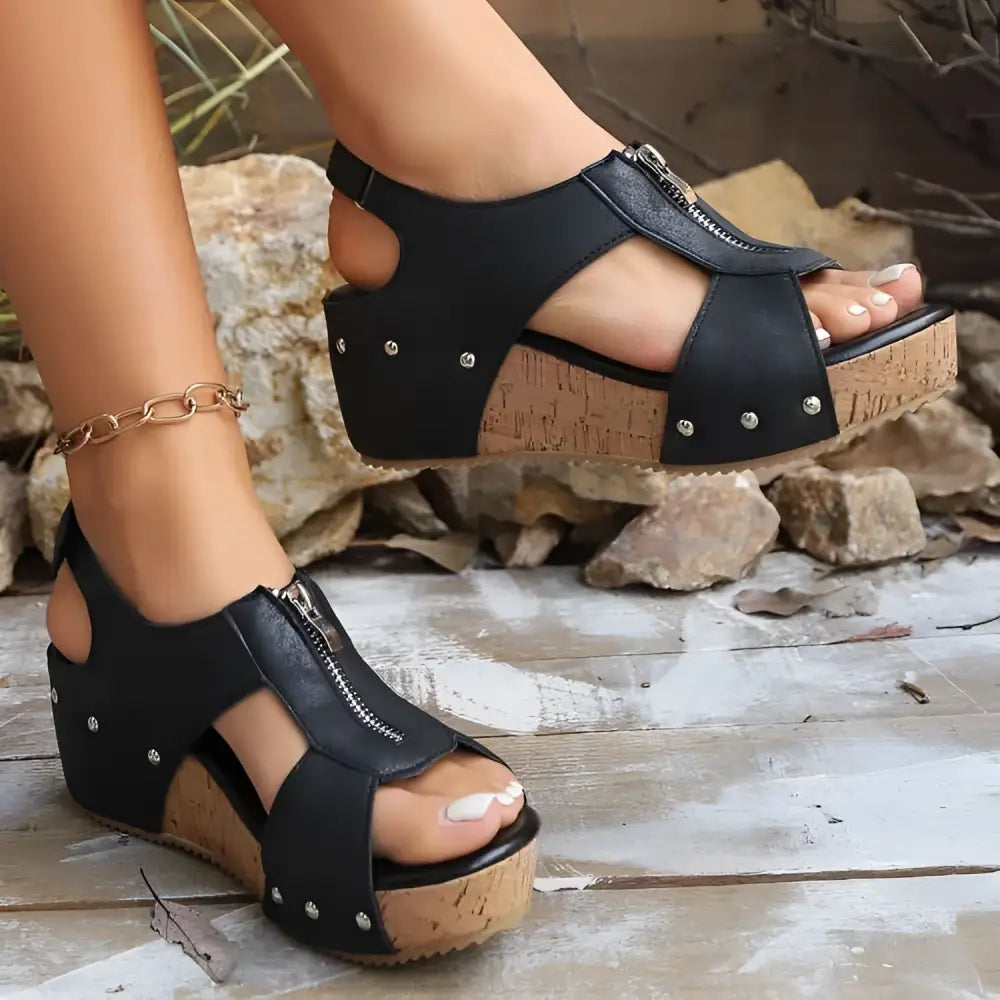Black studded leather zipper wedges sandals with lightweight height increasing cork soles and side zipper detail