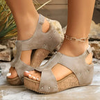 Gray suede zipper wedges sandals with cork soles and silver studs featuring lightweight height increasing design