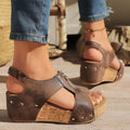 Brown distressed leather zipper wedges sandals with silver studs and lightweight height increasing cork soles