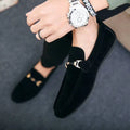 Black suede casual loafers with gold-tone horsebit buckle and flat heel for stylish everyday wear