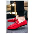 Red suede loafers with gold-tone horsebit buckle accent and flat heel for casual wear