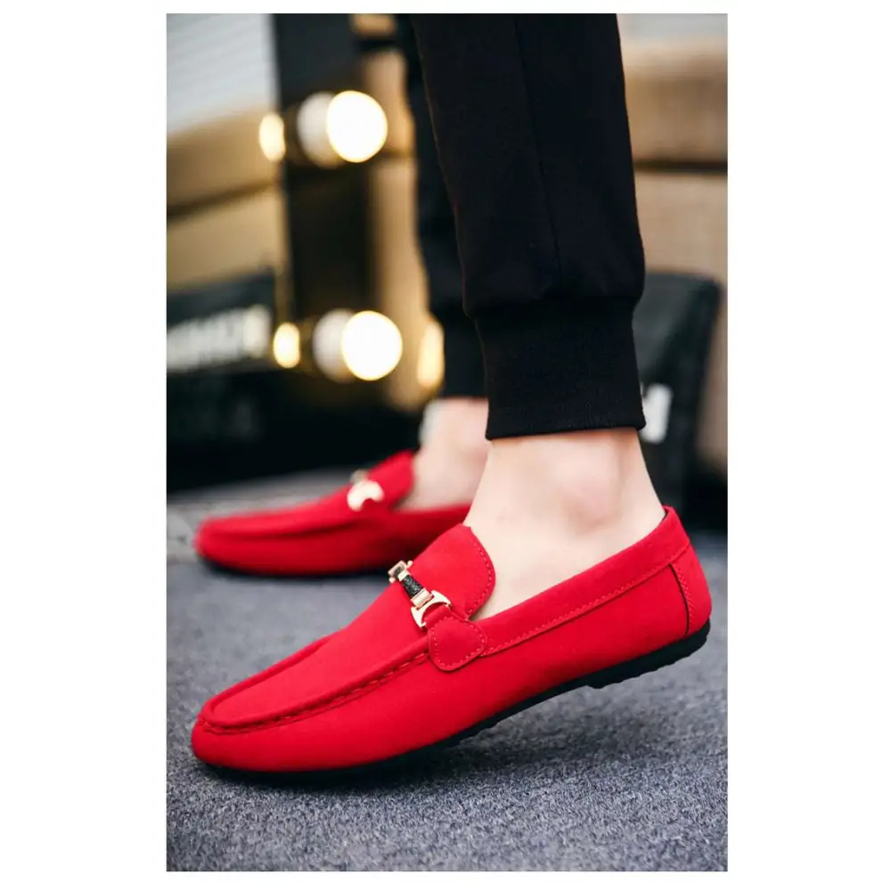 Red suede loafers with gold-tone horsebit buckle accent and flat heel for casual wear