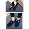 Navy blue suede loafers with flat heel and gold-tone horsebit buckle for casual wear