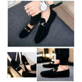 Black suede casual loafers featuring a gold-tone horsebit buckle and flat heel for elegant everyday wear