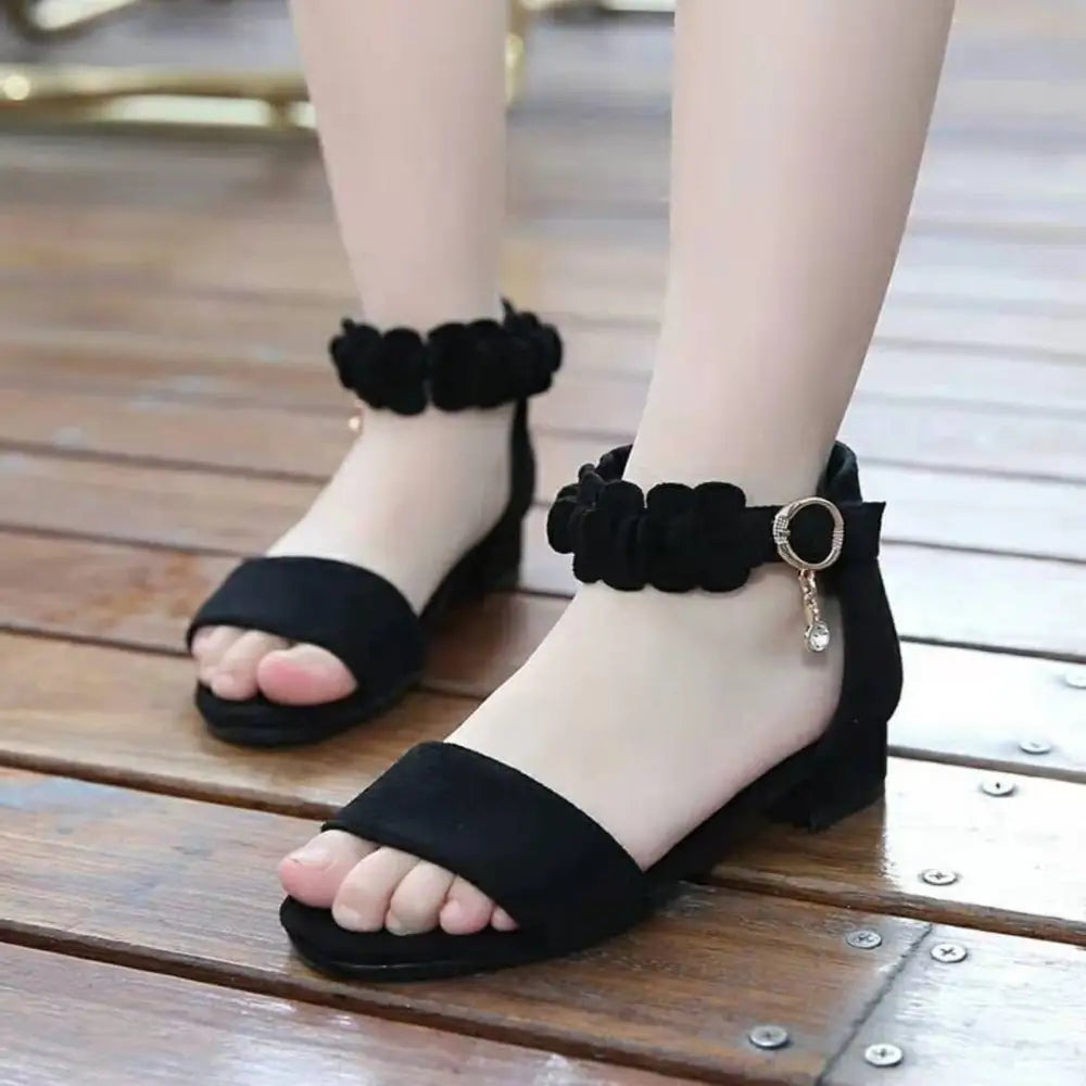 Black suede floral girls sandals with ankle straps and metallic charm for beach big princess occasions