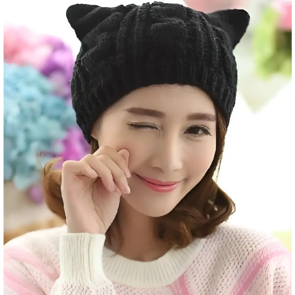 Black textured cute knitted cat ear beanie made of soft yarn perfect for stylish winter wear
