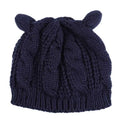 Black textured cute knitted cat ear beanie in dark navy blue with cable knit pattern and soft rounded ear-like protrusions