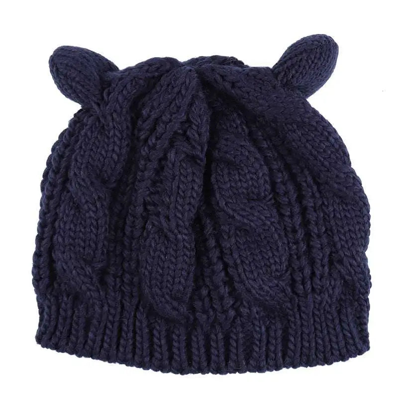 Black textured cute knitted cat ear beanie in dark navy blue with cable knit pattern and soft rounded ear-like protrusions