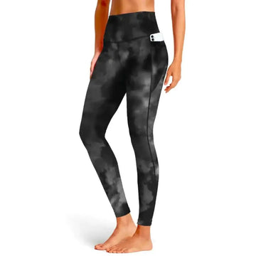 Black tie dye tummy control leggings with high waist and side pocket holding a white phone