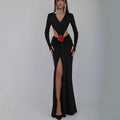 Black v-neck backless long sleeves skirt waist gown with plunging neckline side cutouts and red floral accent