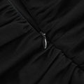 Black v-neck backless long sleeves skirt waist gown showing black ruched fabric with sleek metallic zipper pull
