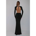 A sleek black v-neck backless long sleeves skirt waist gown featuring a ruched waist and back tie detail viewed from the back