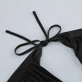 Black satin halter top with tied shoulder straps, part of black v-neck backless long sleeves skirt waist gown collection