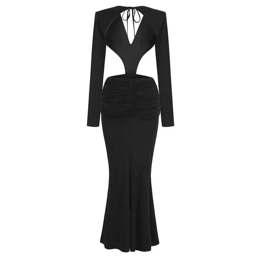 Black v-neck backless long sleeves skirt waist gown with ruched waist and back tie detail viewed from the back
