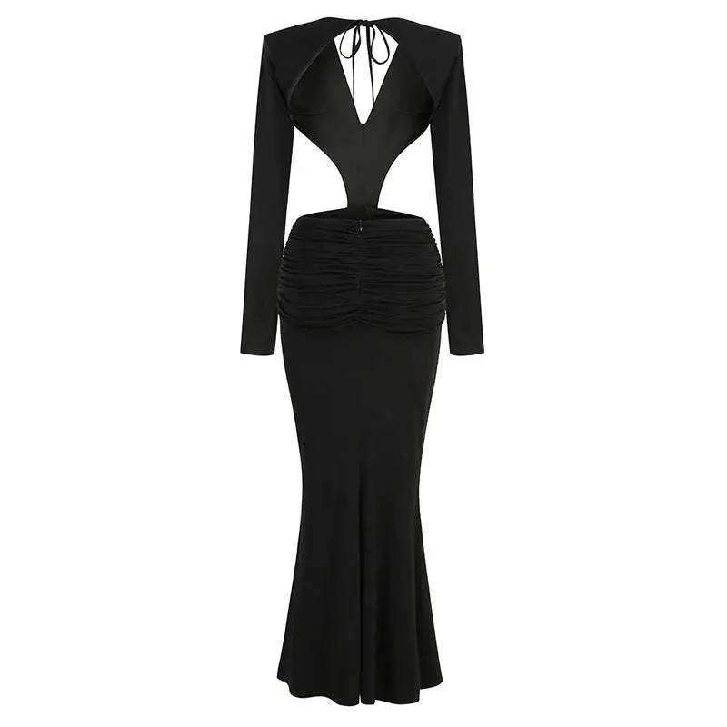 Black v-neck backless mermaid dress with long sleeves, ruched waist, and skirt waist gown shown from the back