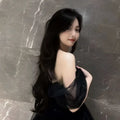 Black velvet off-the-shoulder dress with sheer tulle overlay elegant light luxury evening wear