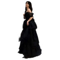 Elegant black velvet and tulle light luxury evening dress with off-the-shoulder design and subtle glitter accents
