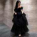 Elegant black velvet off-the-shoulder ball gown with layered tulle and sparkling embellishments for light luxury evening wear