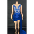 A royal blue velvet luxury evening dress with intricate lace detailing and a flowing side slit for elegant occasions